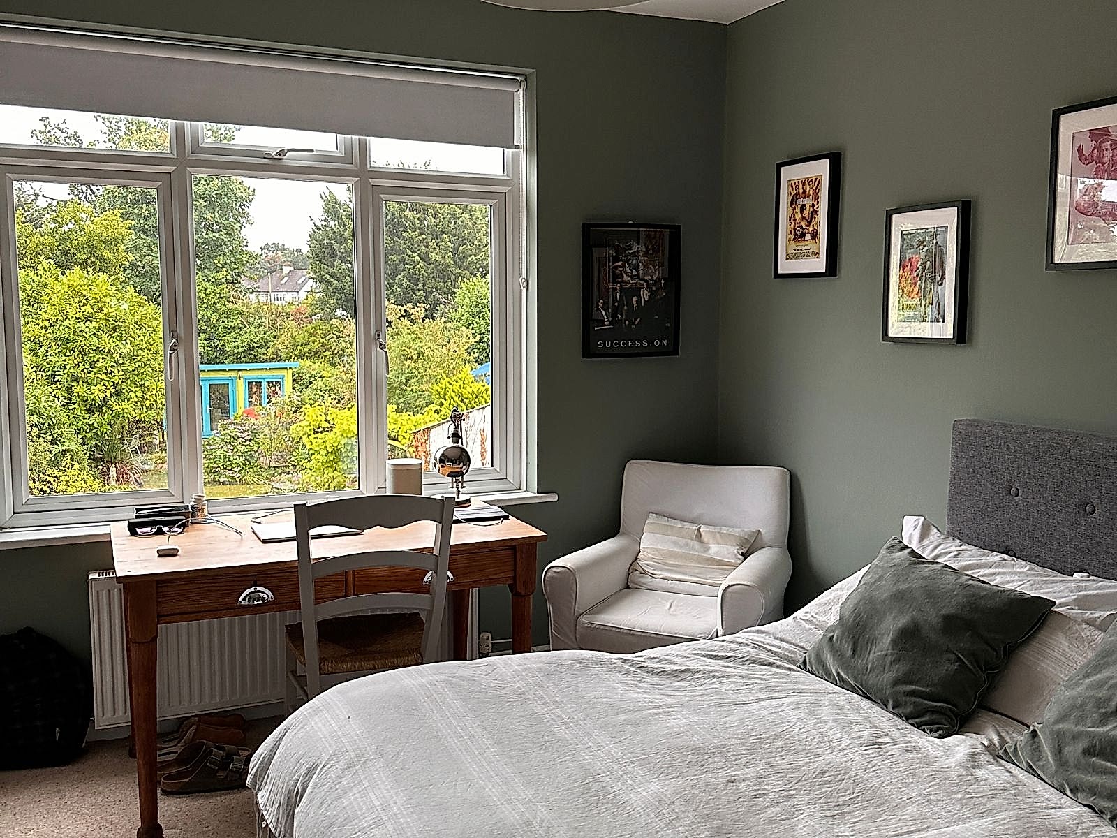 A bright student bedroom with a study desk in a West Wickham host home
